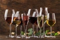 Wine tasting, still and sparkling wines. Red, white wine, rose and champagne ÃËÃâ assortment in wine glasses on vintage wooden Royalty Free Stock Photo